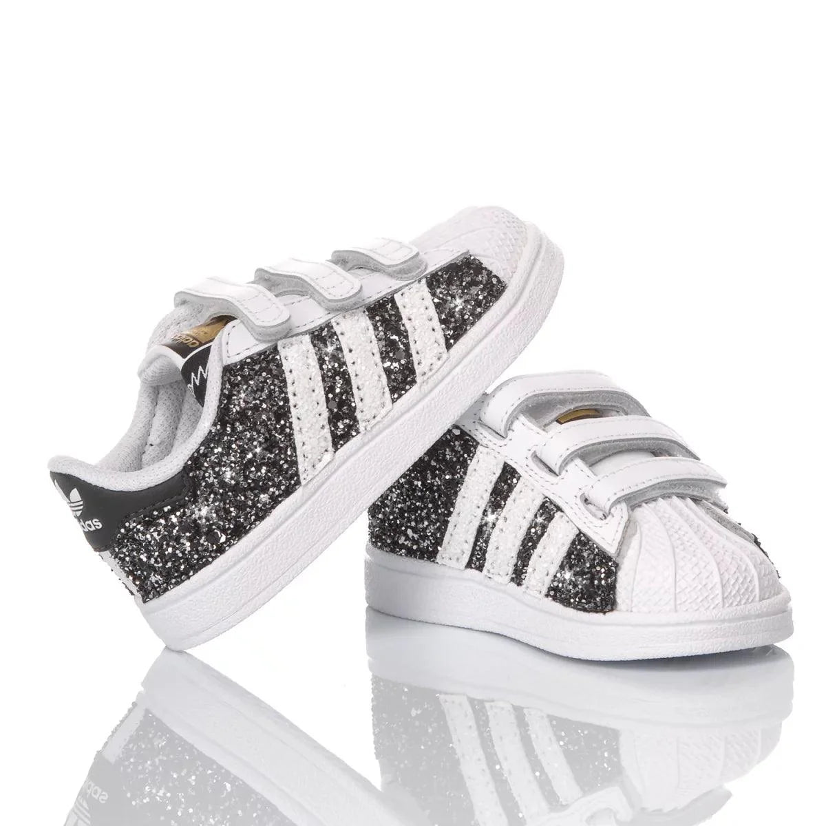 Scarpe premaman bambino glitterate nere e bianche con strisce laterali, chiusura a strappo.
