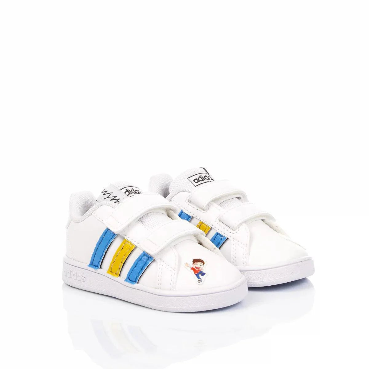 Scarpe bianche bambina con chiusura a strappo, strisce blu e gialle e dettaglio cartoon