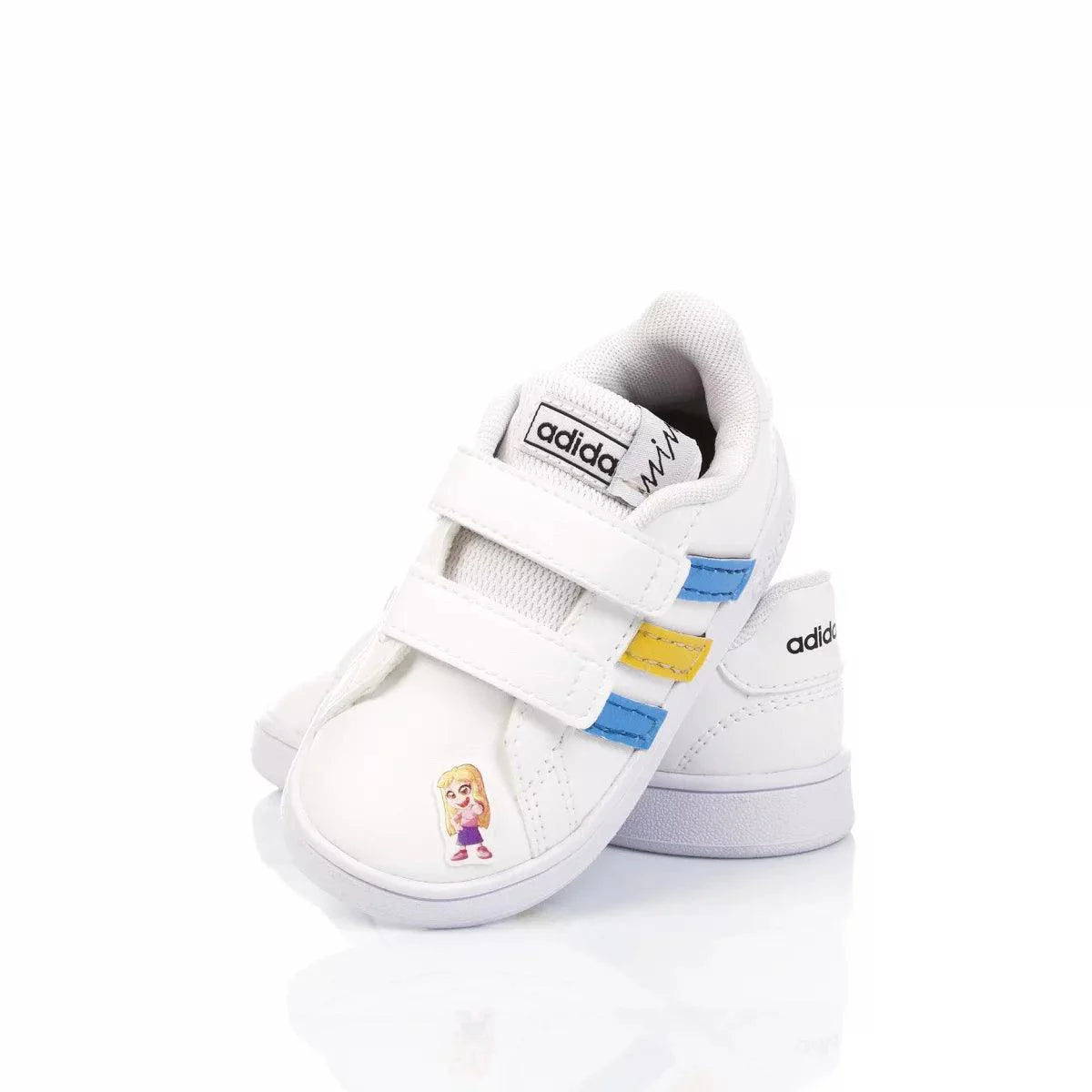 Scarpe bianche per bambini con chiusura a strappo, dettagli azzurri e gialli, disegno cartoon sul davanti.