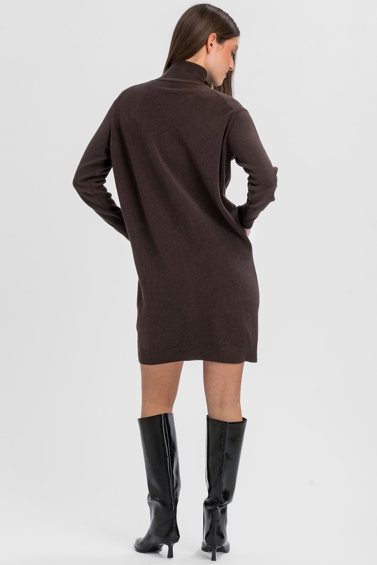Brown long-sleeve maternity knit dress.