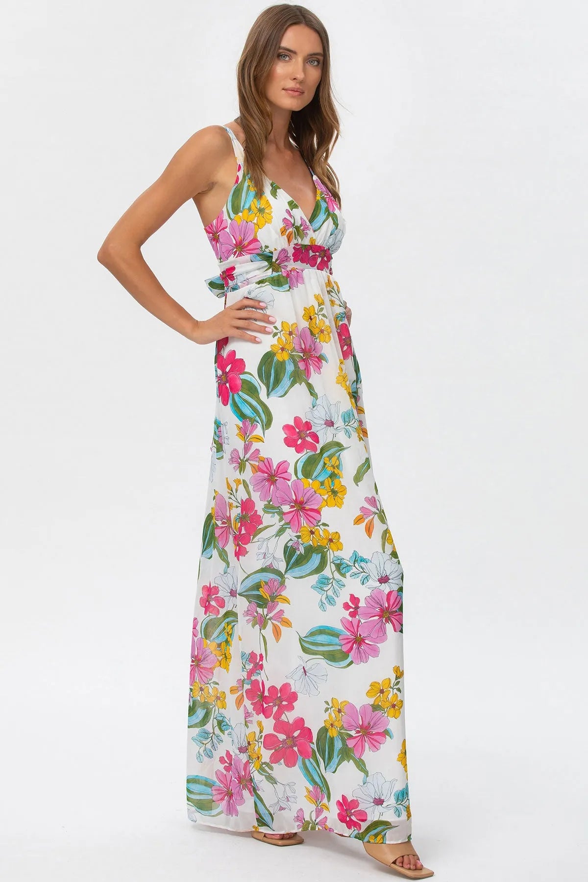 Abito premaman lungo a fiori colorati, scollo a V, tessuto leggero, stile estivo elegante.