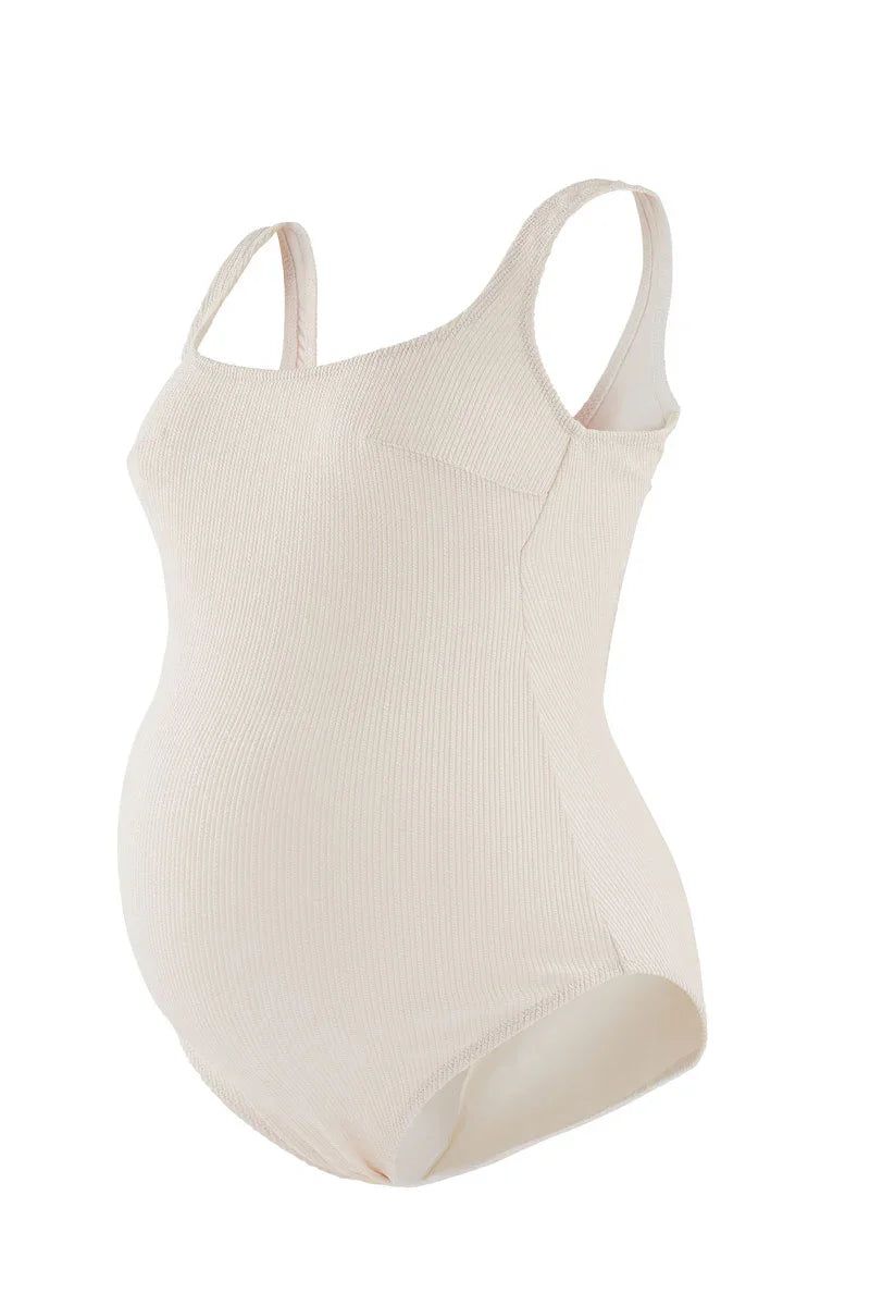 Costume intero premaman beige in tessuto elasticizzato con spalline larghe.