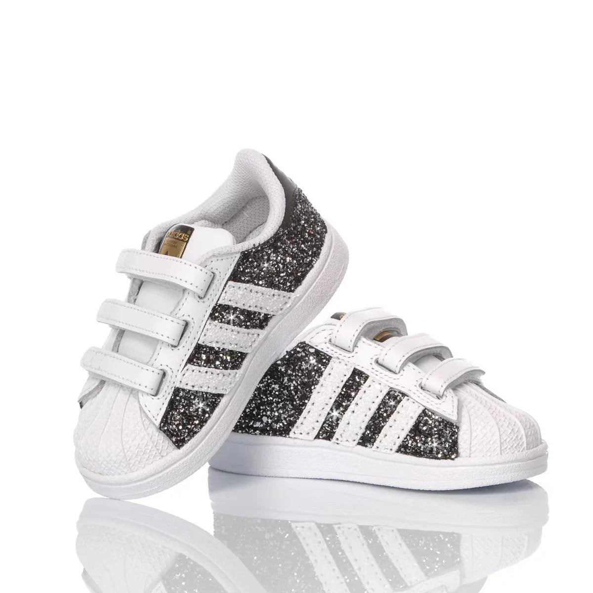 Scarpe bianche con glitter nere per bambini, ideali per abbigliamento premaman trendy