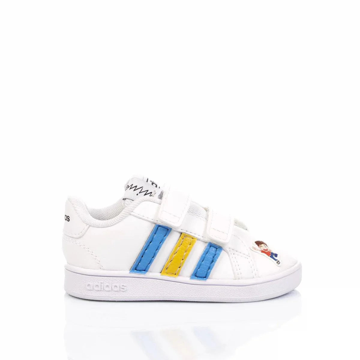 Scarpa da bambini bianca con strisce blu e gialla, chiusura a strappo e dettaglio cartone animato sulla punta.
