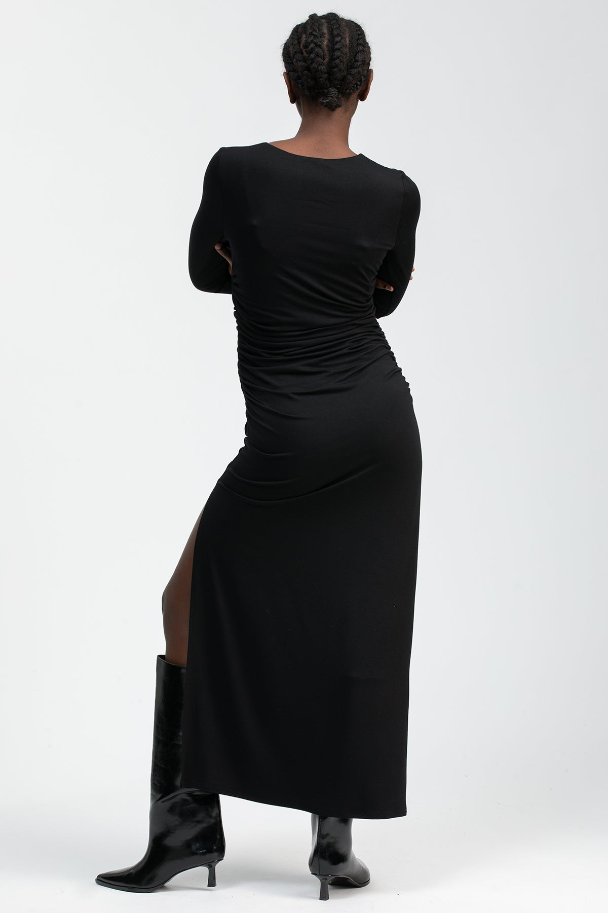 Black maternity dress with a round neckline, side ruching and a fitted silhouette