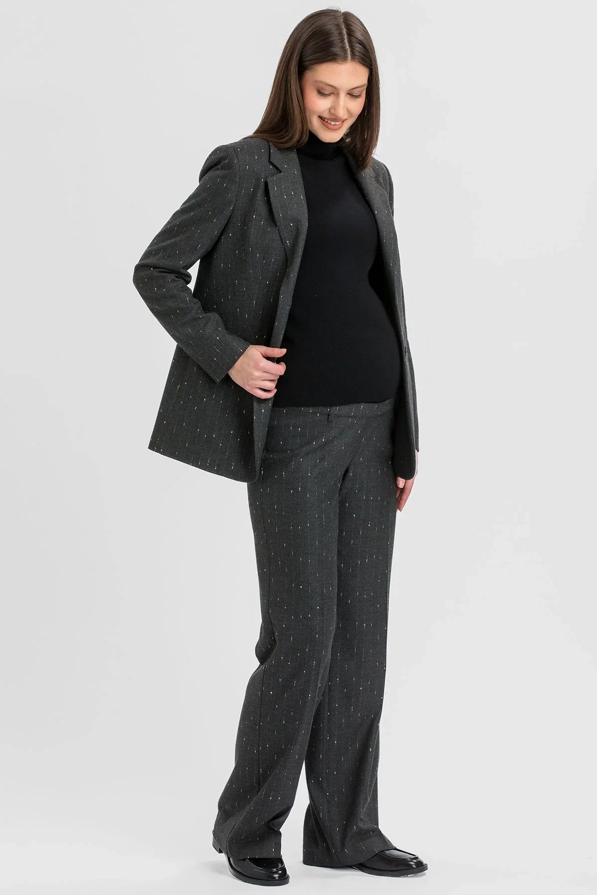 Elegant maternity suit with subtle shimmering details.